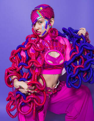 brightly coloured gender-affirming, adaptive outfit being modelled